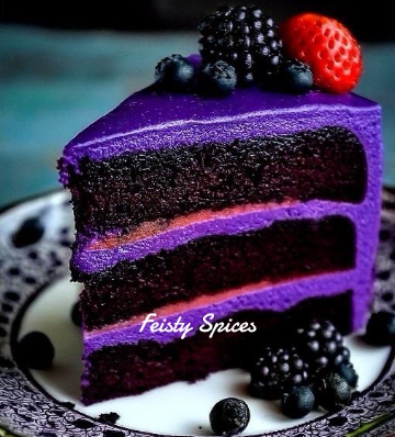 Slice of three-layer dark chocolate cake with purple frosting topped with berries on a decorative plate